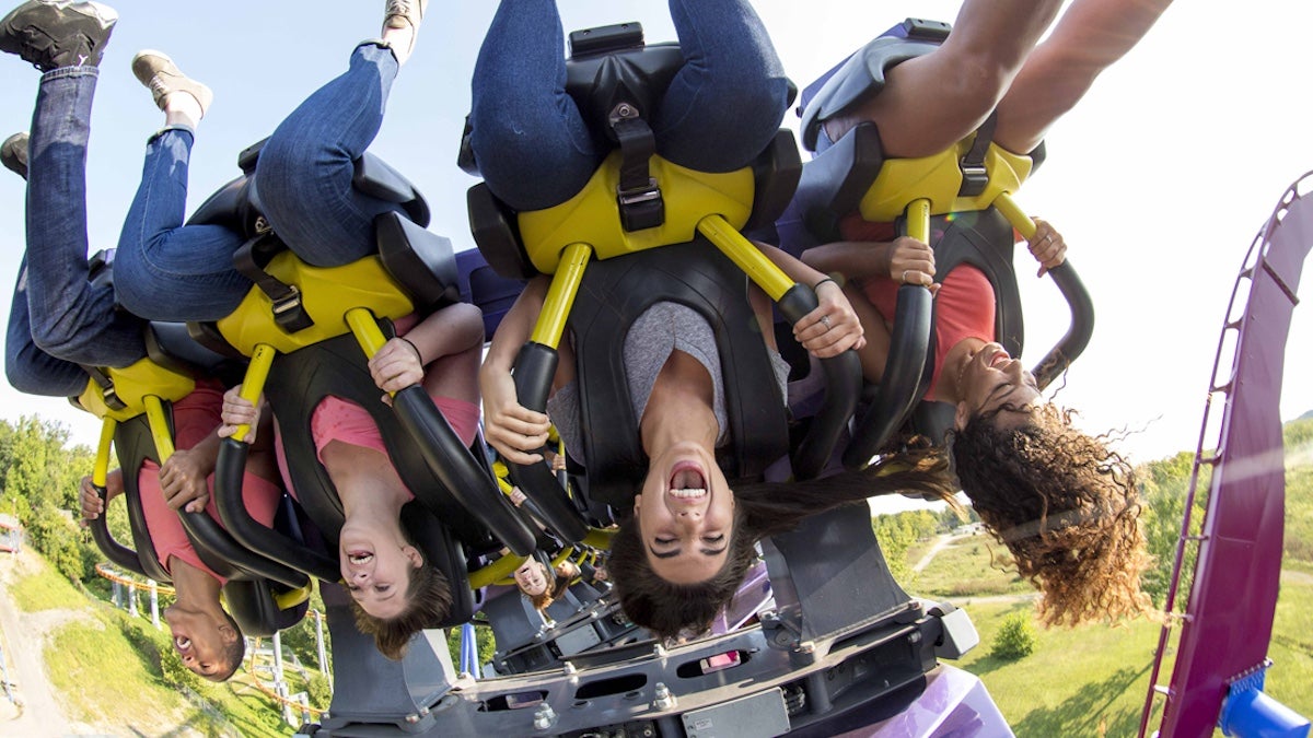 Riders upside down on a roller coaster at Kings Island